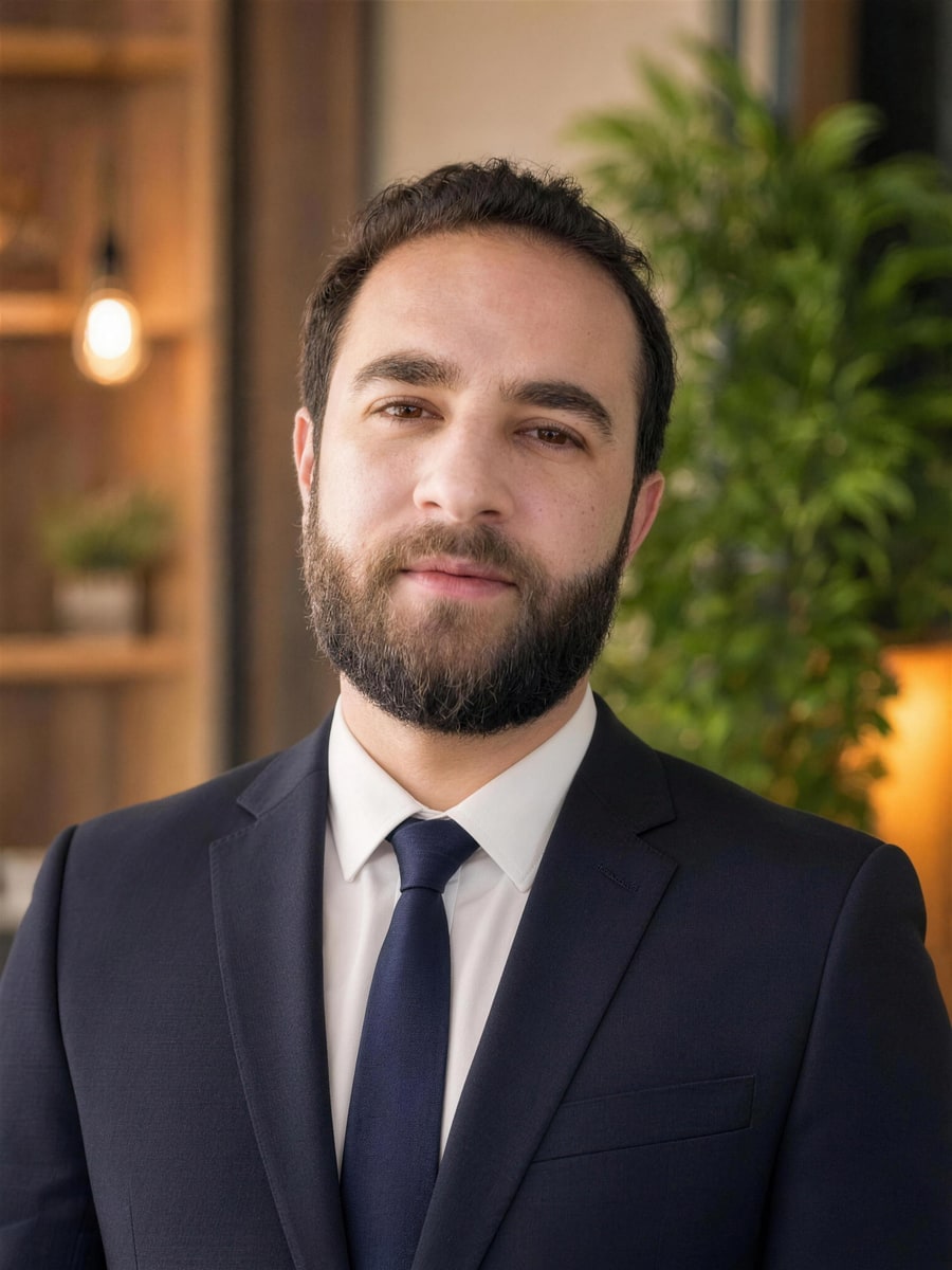 Ahmed Hussein standing in his office